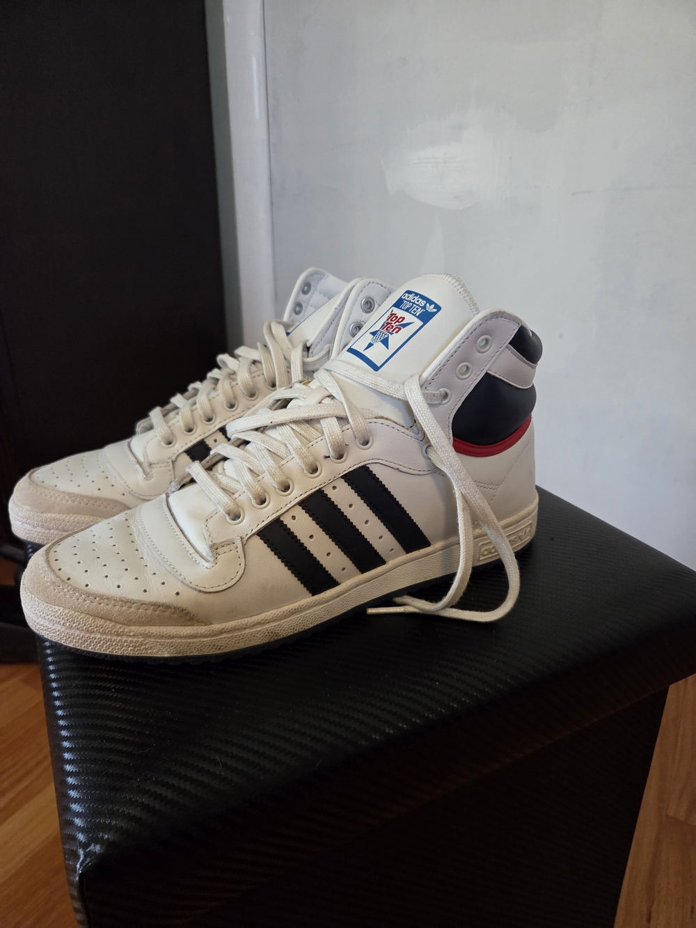 adidas Men’s White High-Top Sneakers with Black Stripes and Red Heel Accent